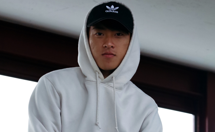 man wearing a white hoodie - logo branded hoodies