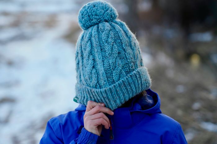why do some beanies have pom poms